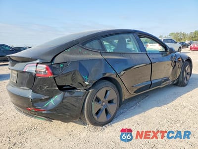 Trzecie zdjęcie samochodu z tyłu: 2023 TESLA MODEL 3 VIN:5YJ3E1EA0PF547061 - miniatura