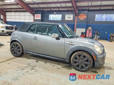 Czwarte zdjęcie samochodu z boku: 2009 MINI COOPER S VIN:WMWMS33559TY50011 - miniatura