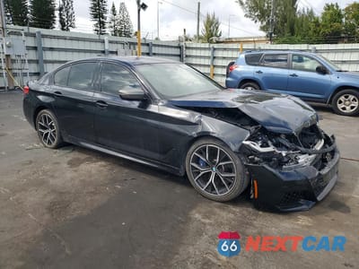 Czwarte zdjęcie samochodu z boku: 2021 BMW M550XI VIN:WBA13BK03MCG26571 - miniatura