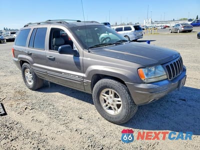 Czwarte zdjęcie samochodu z boku: 2000 JEEP GRAND CHEROKEE LIMITED VIN:1J4GW58S4YC378763 - miniatura