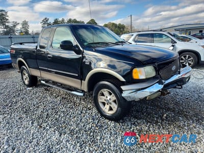 Czwarte zdjęcie samochodu z boku: 2002 FORD F150 VIN:1FTRX18L72NB17510 - miniatura