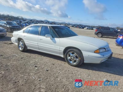 Czwarte zdjęcie samochodu z boku: 1999 PONTIAC BONNEVILLE SE VIN:1G2HX52K2XH233680 - miniatura
