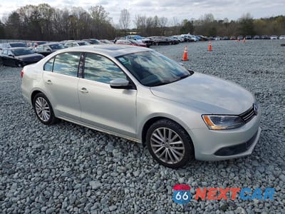 Czwarte zdjęcie samochodu z boku: 2011 VOLKSWAGEN JETTA SEL VIN:3VWLX7AJ1BM338545 - miniatura