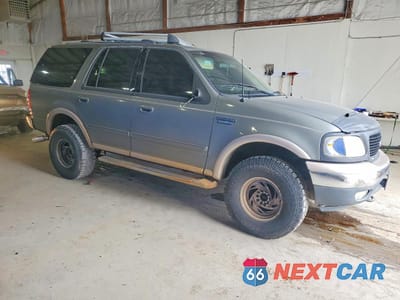 Czwarte zdjęcie samochodu z boku: 1999 FORD EXPEDITION VIN:1FMPU18L7XLB17991 - miniatura