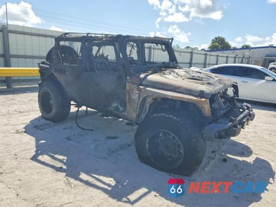 Czwarte zdjęcie samochodu z boku: 2016 JEEP WRANGLER UNLIMITED RUBICON VIN:1C4BJWFG7GL114616 - miniatura