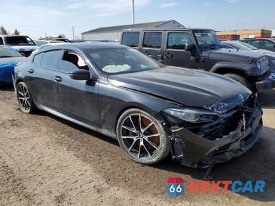 Czwarte zdjęcie samochodu z boku: 2020 BMW M850XI VIN:WBAGV8C09LBP48956 - miniatura