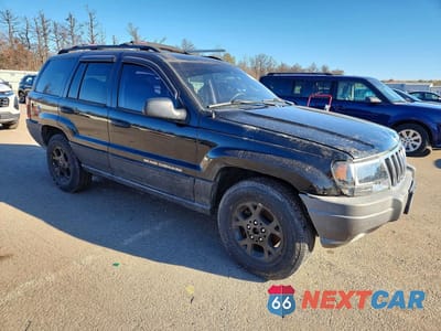 Czwarte zdjęcie samochodu z boku: 2002 JEEP GRAND CHEROKEE SPORT VIN:1J8GW38S42C236293 - miniatura
