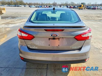 Zdjęcie 6 z 12 samochodu: 2013 FORD FOCUS TITANIUM VIN:1FADP3J2XDL231903 - miniatura