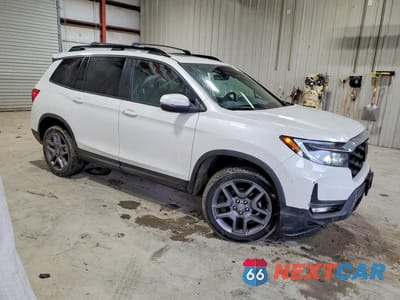 Czwarte zdjęcie samochodu z boku: 2023 HONDA PASSPORT EXL VIN:5FNYF8H58PB037292 - miniatura