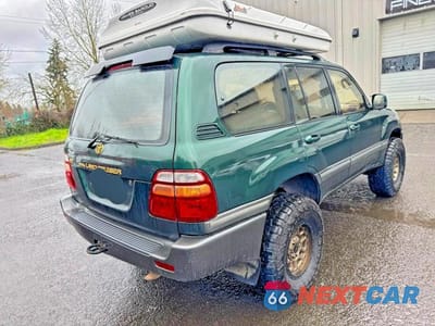 Czwarte zdjęcie samochodu z boku: 1999 TOYOTA LAND CRUISER BASE VIN:JT3HT05J4X0040771 - miniatura