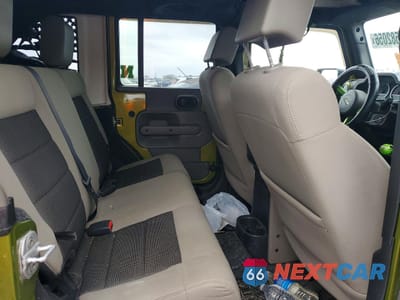 Zdjęcie 11 z 13 samochodu: 2010 JEEP WRANGLER UNLIMITED SAHARA VIN:1J4BA5H19AL203012 - miniatura