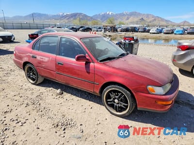 Czwarte zdjęcie samochodu z boku: 1997 TOYOTA COROLLA DX VIN:1NXBB02E5VZ608619 - miniatura