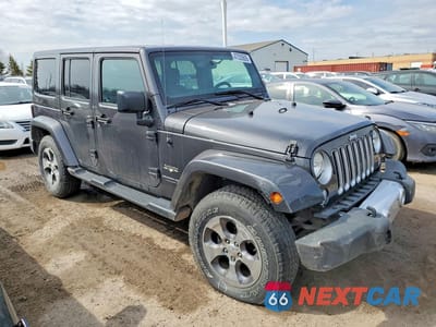 Czwarte zdjęcie samochodu z boku: 2018 JEEP WRANGLER UNLIMITED SAHARA VIN:1C4BJWEG4JL900169 - miniatura