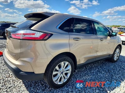 Trzecie zdjęcie samochodu z tyłu: 2021 FORD EDGE TITANIUM VIN:2FMPK4K91MBA21094 - miniatura