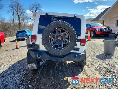 Zdjęcie 6 z 11 samochodu: 2016 JEEP WRANGLER UNLIMITED SAHARA VIN:1C4BJWEGXGL107869 - miniatura