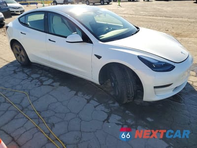 Czwarte zdjęcie samochodu z boku: 2023 TESLA MODEL 3 VIN:5YJ3E1EA2PF566680 - miniatura