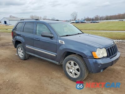 Czwarte zdjęcie samochodu z boku: 2010 JEEP GRAND CHEROKEE LAREDO VIN:1J4PR4GK1AC138093 - miniatura