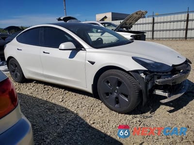 Czwarte zdjęcie samochodu z boku: 2022 TESLA MODEL 3 VIN:5YJ3E1EB4NF178727 - miniatura