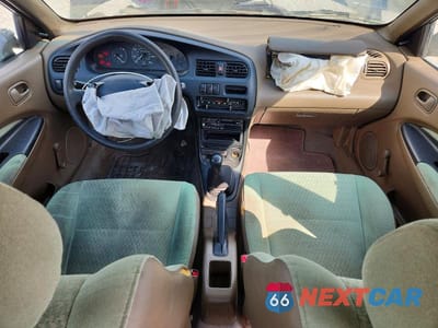 Zdjęcie 8 z 12 samochodu: 1996 MAZDA PROTEGE DX VIN:JM1BB1415T0327980 - miniatura