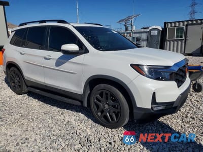 Czwarte zdjęcie samochodu z boku: 2022 HONDA PASSPORT EXL VIN:5FNYF7H56NB006498 - miniatura