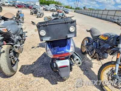 Czwarte zdjęcie samochodu z boku: 2006 HONDA FSC600 D VIN:JH2PF01146K400748 - miniatura