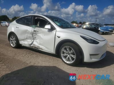 Czwarte zdjęcie samochodu z boku: 2022 TESLA MODEL Y VIN:7SAYGAEE2NF316438 - miniatura