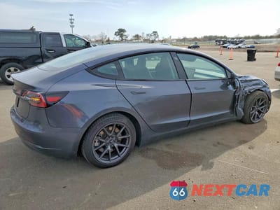 Trzecie zdjęcie samochodu z tyłu: 2023 TESLA MODEL 3 VIN:5YJ3E1EA9PF680966 - miniatura