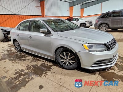 Czwarte zdjęcie samochodu z boku: 2016 VOLKSWAGEN JETTA UNKNOWN VIN:3VWD67AJXGM311357 - miniatura