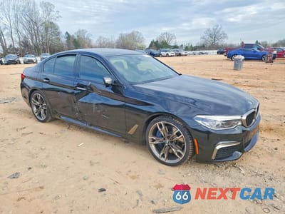 Czwarte zdjęcie samochodu z boku: 2018 BMW M550XI VIN:WBAJB9C5XJB049879 - miniatura