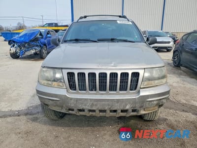 Piąte zdjęcie samochodu w środku: 1999 JEEP GRAND CHEROKEE LIMITED VIN:1J4GW68N1XC671972 - miniatura