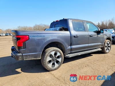 Trzecie zdjęcie samochodu z tyłu: 2022 FORD F150 LIGHTNING PRO VIN:1FT6W1EV7NWG03499 - miniatura