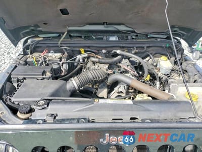 Zdjęcie 11 z 12 samochodu: 2010 JEEP WRANGLER SAHARA VIN:1J4AA5D19AL123176 - miniatura