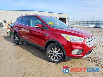 Czwarte zdjęcie samochodu z boku: 2018 FORD ESCAPE TITANIUM VIN:1FMCU0J93JUA02183 - miniatura
