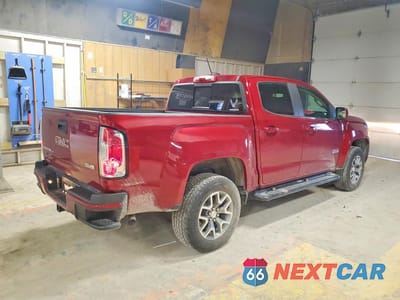 Trzecie zdjęcie samochodu z tyłu: 2018 GMC CANYON SLE VIN:1GTG6CENXJ1219028 - miniatura