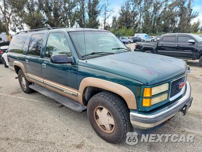 Czwarte zdjęcie samochodu z boku: 1996 GMC SUBURBAN K1500 VIN:1GKFK16R2TJ733816 - miniatura