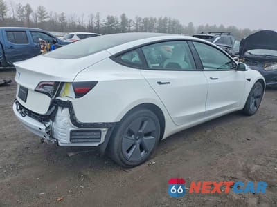 Trzecie zdjęcie samochodu z tyłu: 2023 TESLA MODEL 3 VIN:5YJ3E1EA5PF495832 - miniatura