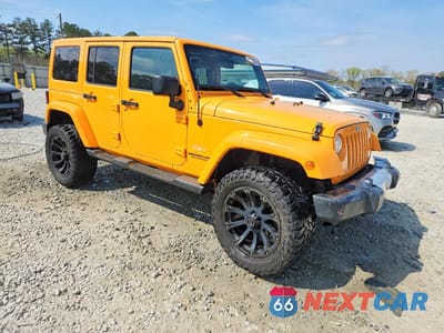 Czwarte zdjęcie samochodu z boku: 2012 JEEP WRANGLER UNLIMITED SAHARA VIN:1C4BJWEGXCL133897 - miniatura