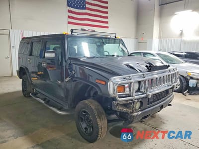 Czwarte zdjęcie samochodu z boku: 2005 HUMMER H2 VIN:5GRGN23U75H107869 - miniatura