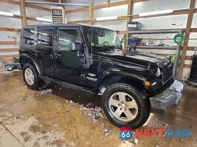 Czwarte zdjęcie samochodu z boku: 2009 JEEP WRANGLER UNLIMITED SAHARA VIN:1J4GA59149L749734 - miniatura