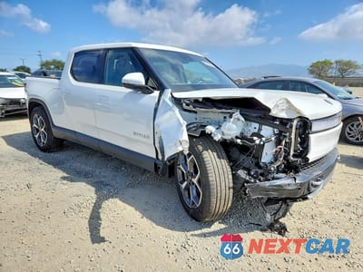 Czwarte zdjęcie samochodu z boku: 2024 RIVIAN R1T ADVENTURE VIN:7FCTGBAA3RN033290 - miniatura