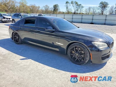 Czwarte zdjęcie samochodu z boku: 2014 BMW 750 LI VIN:WBAYE8C55ED135448 - miniatura
