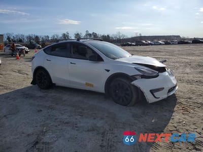Czwarte zdjęcie samochodu z boku: 2021 TESLA MODEL Y VIN:5YJYGDEE3MF192970 - miniatura