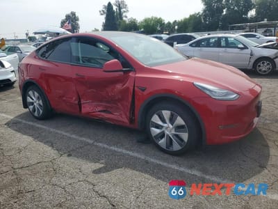 Czwarte zdjęcie samochodu z boku: 2023 TESLA MODEL Y VIN:7SAYGDEE0PA110973 - miniatura