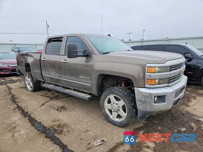 Czwarte zdjęcie samochodu z boku: 2015 CHEVROLET SILVERADO K2500 HEAVY DUTY LTZ VIN:1GC1KWEG8FF107360 - miniatura