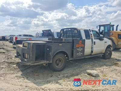 Trzecie zdjęcie samochodu z tyłu: 1999 FORD F350 SUPER DUTY FLATBED TRUCK VIN:1FDWX37F5XEB35128 - miniatura