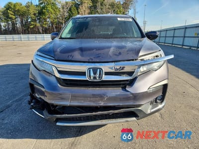 Piąte zdjęcie samochodu w środku: 2021 HONDA PILOT TOURING VIN:5FNYF6H68MB078398 - miniatura