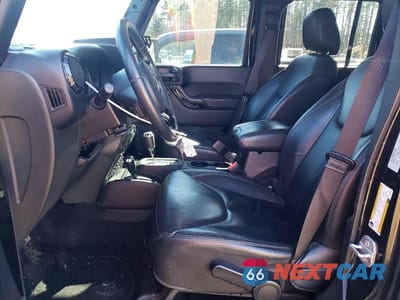 Zdjęcie 7 z 13 samochodu: 2015 JEEP WRANGLER UNLIMITED SAHARA VIN:1C4BJWEGXFL663789 - miniatura