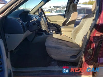 Zdjęcie 7 z 12 samochodu: 1999 JEEP GRAND CHEROKEE LAREDO VIN:1J4GW58S6XC784073 - miniatura