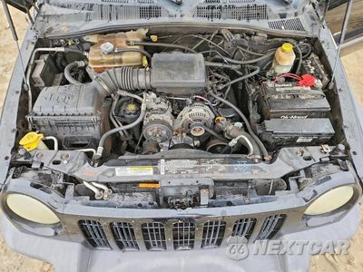 Zdjęcie 12 z 12 samochodu: 2003 JEEP LIBERTY SPORT VIN:1J4GL48K13W688962 - miniatura
