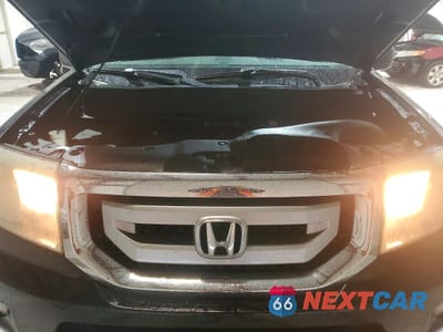 Zdjęcie 12 z 13 samochodu: 2010 HONDA PILOT TOURING VIN:5FNYF4H8XAB011190 - miniatura